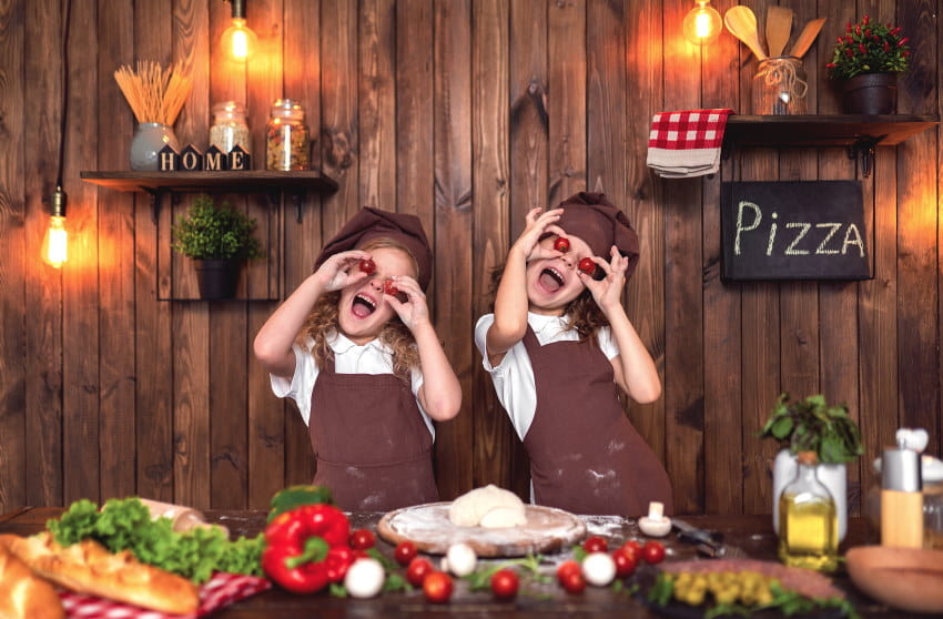 image of two kids making a salad in a cooking class in NJ