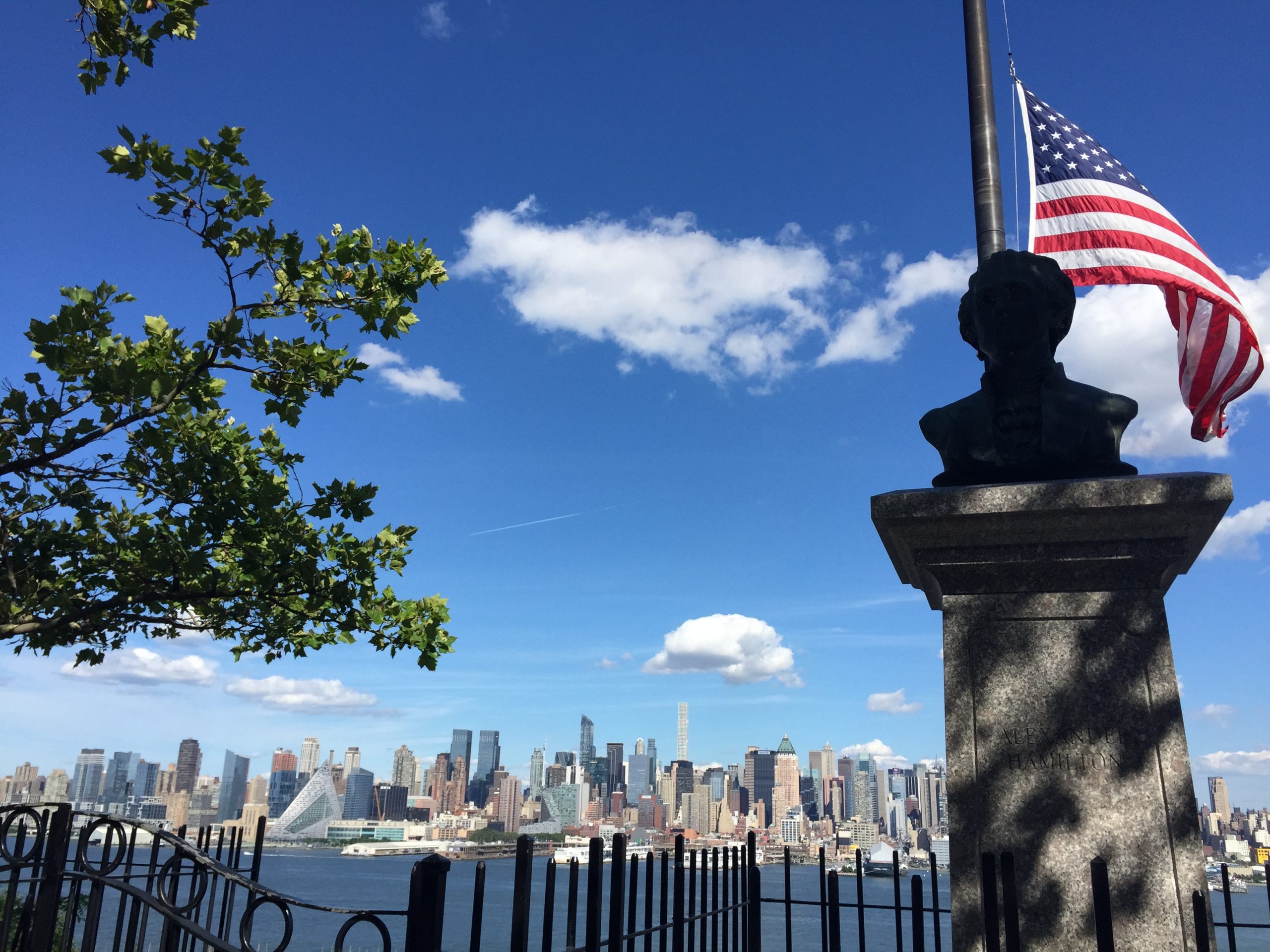 Image of the Hudson river and NY skyline forom the historic Hamilton Park in Jersey City NJ
