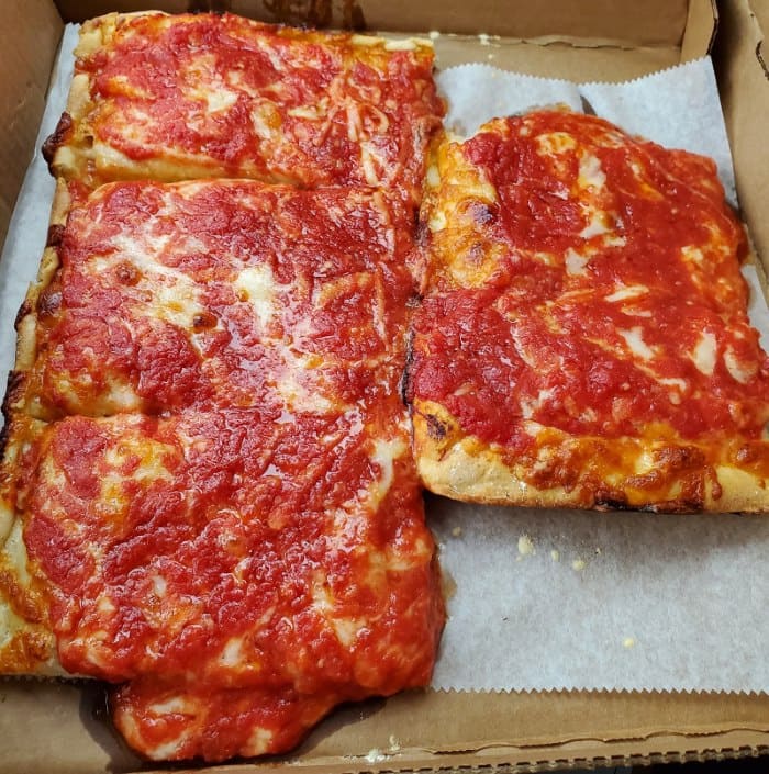 Image of 4 slices of pizza from Kate and Al's Pizza at the Columbus Flea Market in Columbus NJ