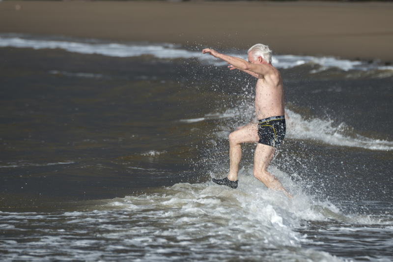 A man in the ocean in NJ doing a Polar Bear plunge