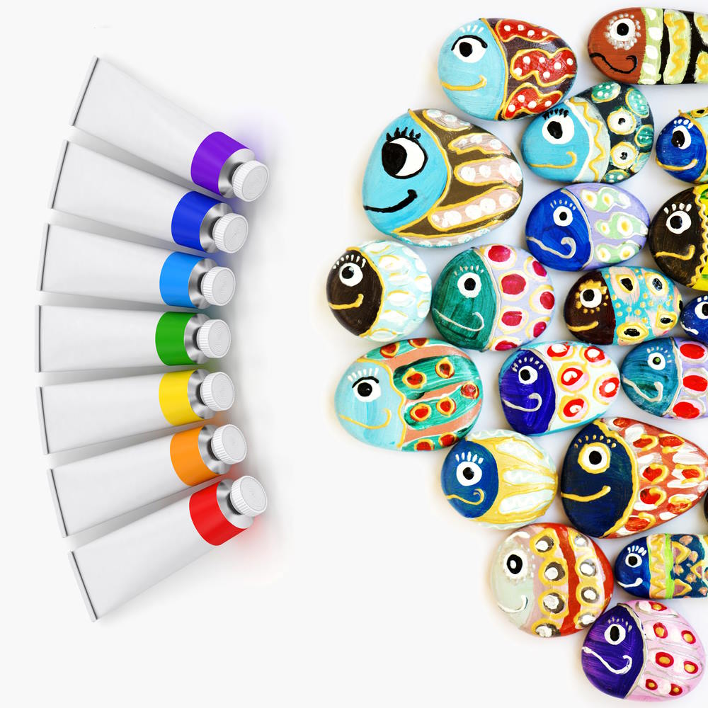 Image of garden rocks painted as fish with 7 tubes of different colored paints.