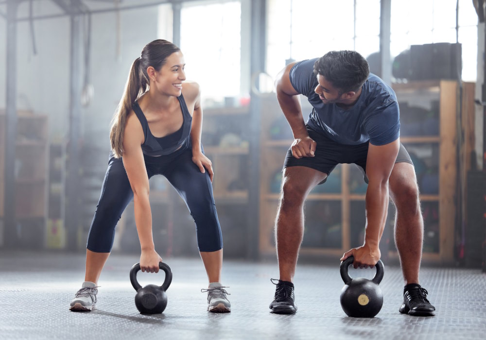 Image of a man and woman working out at a fitness center in NJ