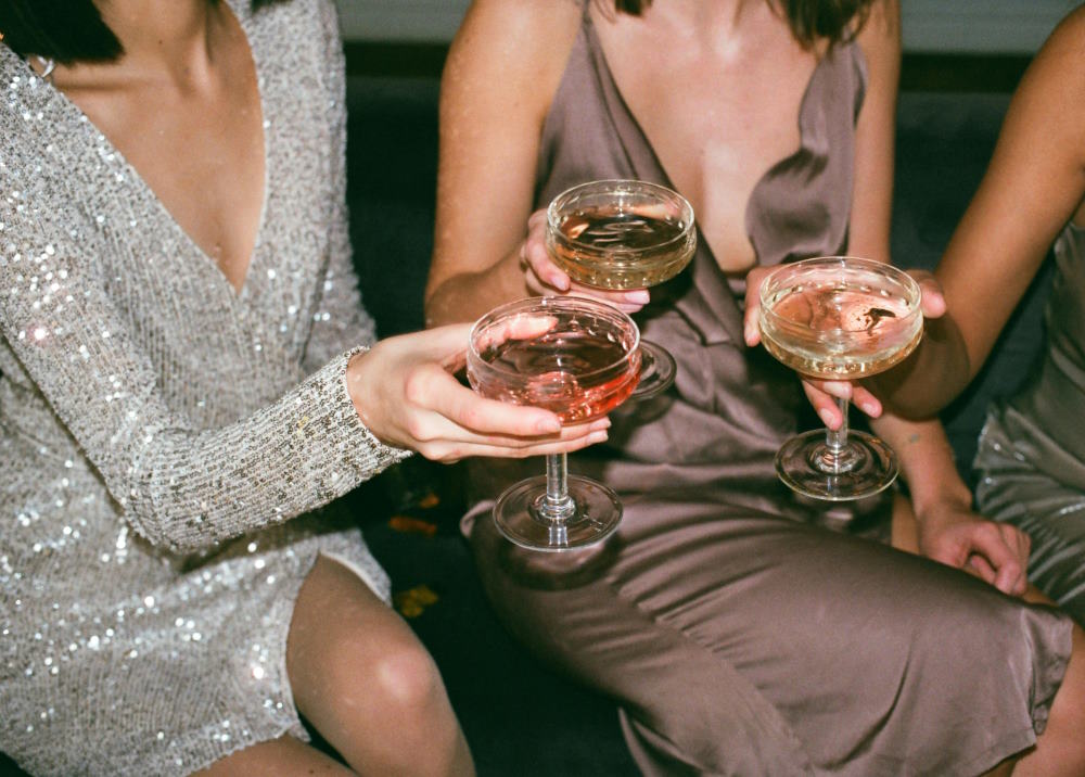 Image of 3 girls drinking wine at a bachelorette party in NJ