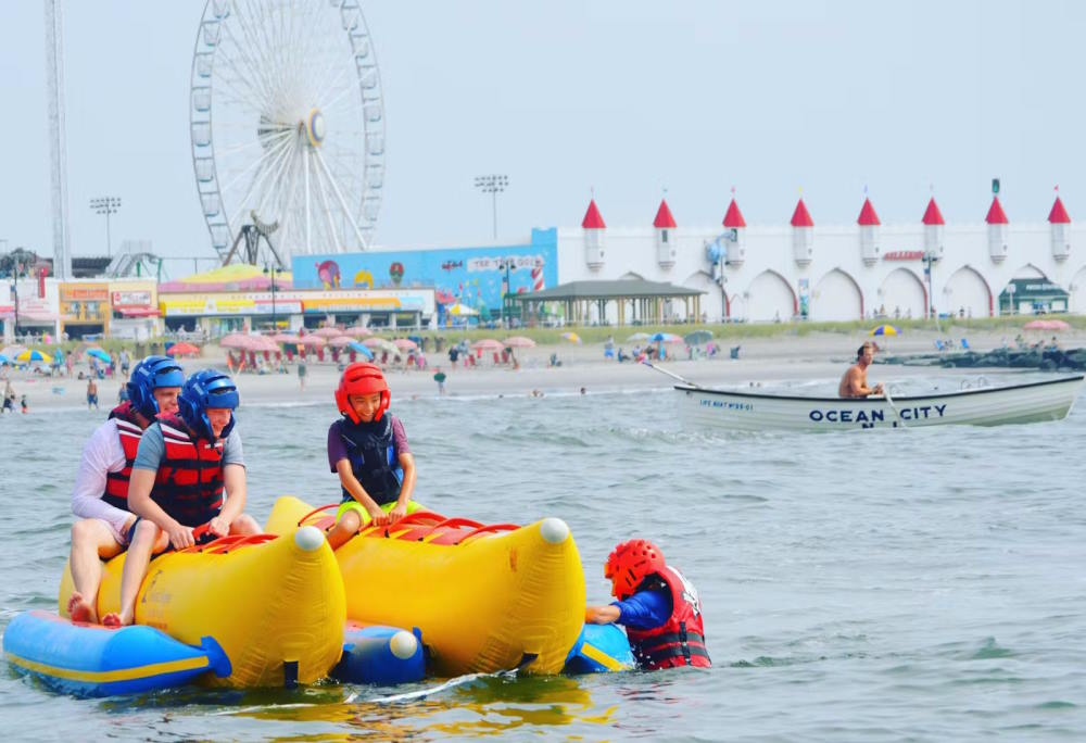Image for kids embarking on banana boat tour off the shore of Ocean City New Jersey.