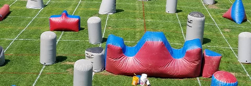 Photo of ABC Paintballs' course with inflatable cover and obsticals on a gree field in Hewitt New Jersey.