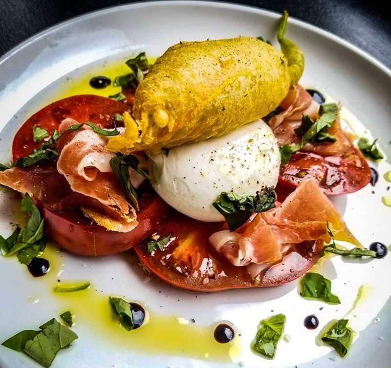 Photo of a tomato and mozzarella salad with Proscuitto from Catch 19 in Red Bank New Jersey.