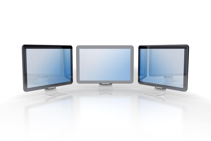 Image of 3 computers on a desk