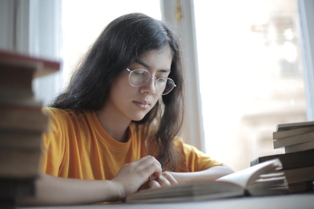 A college student reading literature