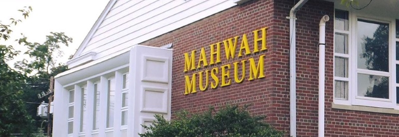 Photo of the front of The Mahwah Museum a red brick building with yellow letters.