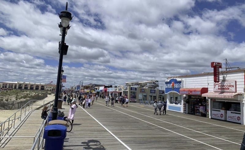 Image of the Ocean City boardwalk on a sunny day as a free attraction to enjoy in NJ