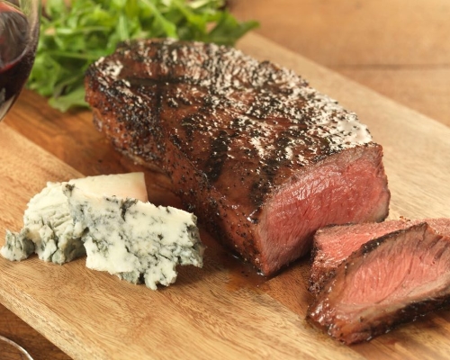 Image of steak and blue cheese on a cutting board from the menu of Salt Creek Grille in Princeton NJ