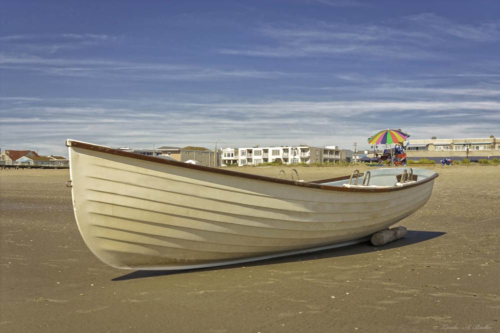 Photo of a  boat on the beach in Ocean city NJ.
