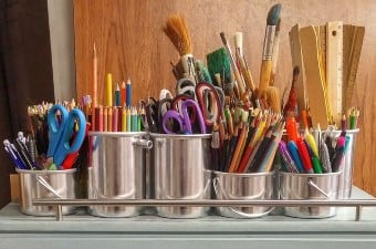 Image of art supplies including colored pencils scissors markers and paintbrushes showing at classes in NJ