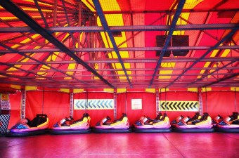 Image of bumper cars in a red and yellow track as one of the best attractions in NJ