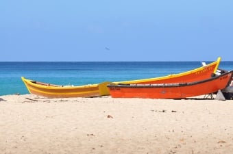 Image of two boats on the sand at the beach as an example of an outdoor adventure in NJ