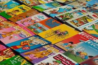 Image of comic books laid out on a table as one of the enthusiast hobbies in NJ