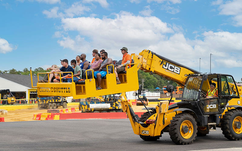 Family takes a ride on the Ground Shuttle ride at Diggerland USA in West Berlin, NJ