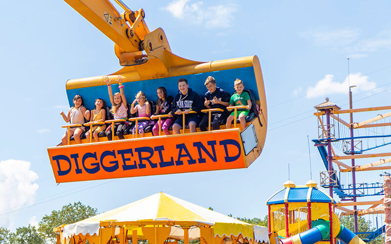 Kids enjoying the thrilling Spin Dizzy attraction at Diggerland USA in West Berlin, NJ