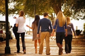 5 people on a city street depicting a group outing