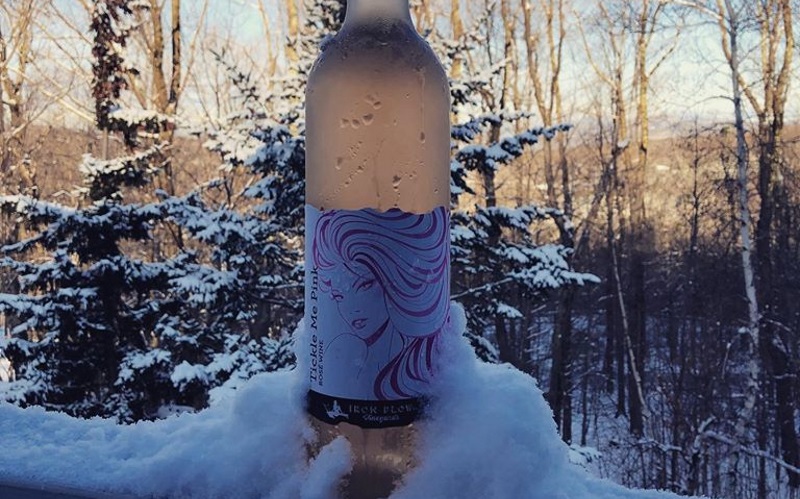 Image of a wine bottle in snow