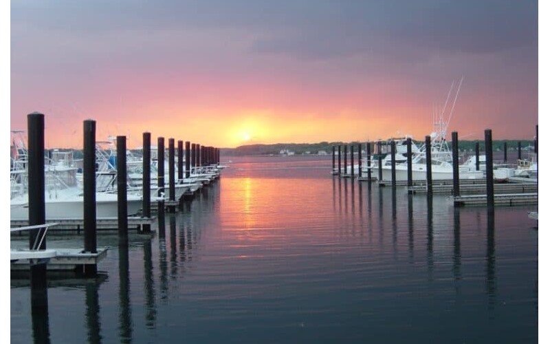 Image of a sunset behind docks in Belmar New Jersey