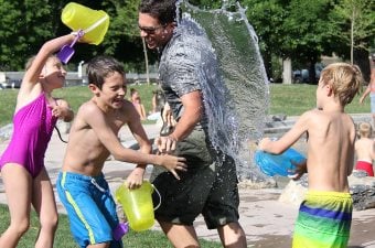 Kids playing outside at a small waterpark at day camp in NJ