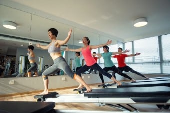 Four girls working out in a Gym depicting a cool thing to do in NJ