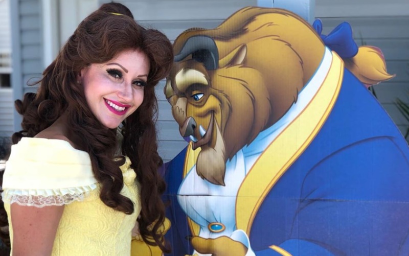 Image of a lady disguised as the beauty from beauty and the beast 